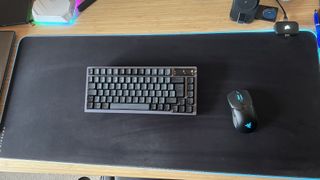 Corsair MM700 RGB Extended mouse pad on a desk with Asus gaming keyboard and Razer mouse