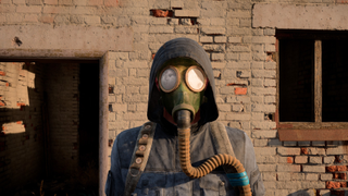 A man in a gas mask and hood