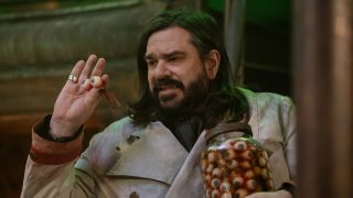 Laszlo pulling eyeballs out of a jar in What We Do in the Shadows Season 6