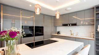 Contemporary gloss grey kitchen with island