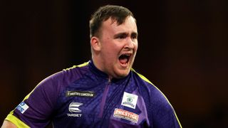 Luke Littler celebrates on his way to the PDC World Darts Championship Final 2024