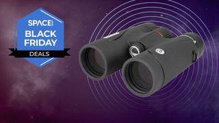 The Celestron TrailSeeker 8x42 binoculars against a backdrop of the night sky with Space.com Black Friday deals badge.