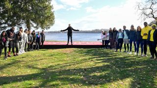 Phil and the Season 36 cast wait on The Amazing Race finish line.