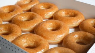 Krispy Kreme doughnuts laid out next to each other