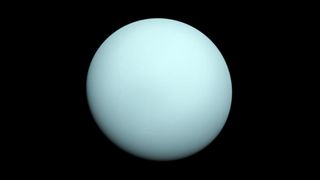 a bluish-green planet sits against the blackness of space