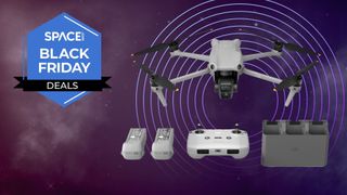 A DJI Air 3 drone, with remote, charging dock and two batteries and a Space Black Friday Deals sign next to it. 