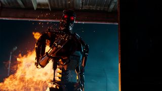 Terminator: Survivors screenshot showing a Terminator: Survivors screenshot showing a T-800 emerging through flame without its human skin suit