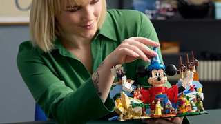 Woman playing with LEGO Ideas Magic of Disney Collectible Building Set