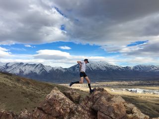 man trail running at altitude