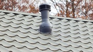 Ventilation shaft on light green roof