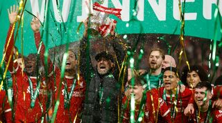 Liverpool players and manager Jurgen Klopp celebrate the Reds&#039; League Cup final win over Chelsea in February 2024.