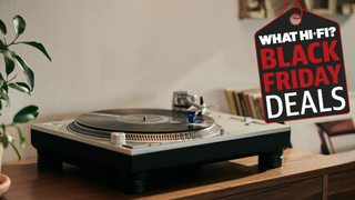 Turntable with records in background and Black Friday graphic