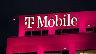 Night shot of the T-Mobile headquarters in Bellevue, Washington, US, lit up in pink.