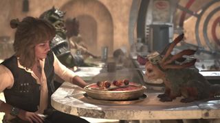 Kay Vess and Nix share a meal on Tatooine in Star Wars Outlaws