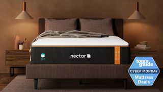 Image shows the Nectar Premier Copper Mattress on a dark bedframe with a blue sales badge overlaid on the bottom right hand corner