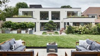 Two properties combined into one connected by a central studio with a back garden with a large bonsai