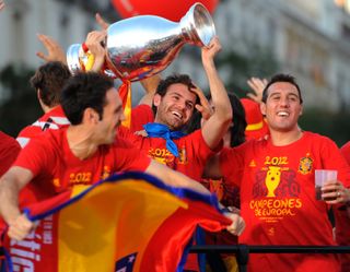 Juanfran (left) celebrates with Juan Mata (centre) and Santi Cazorla in Madrid after Spain&#039;s Euro 2012 win in July 2012.