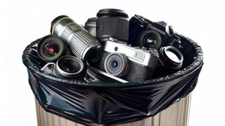 A trashcan full of camera equipment