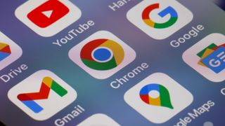 A close up of the Google Chrome app icon on a phone, surrounded by other Google apps such as YouTube, Gmail, and Google Maps.