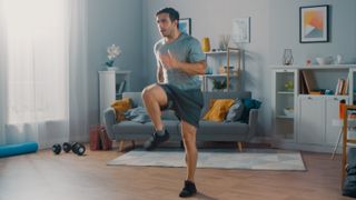 a man working out in his living room