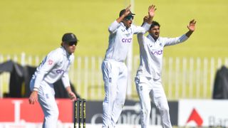 Ollie Pope (L), Joe Root and Shoaib Bashir (R) react at the wicket ahead of the New Zealand vs England 1st Test 2024 in Christchurch, NZ