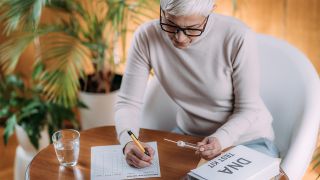 Woman completing an at-home DNA testing kit