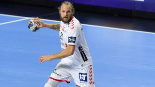 Henrik Mollgaard Jensen of Aalborg Handbold controls the ball during the EHF European League semi final match between Paris Saint Germain and Aalborg Handbold at Lanxess Arena on June 12, 2021 in Cologne, Germany. 