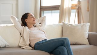 A woman relaxing on a sofa