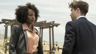 Millie Black (Tamara Lawrence) and Luke Holborn (Joe Dempsie), dressed in a sharp grey and navy blue suit respectively, look directly into each other&#039;s eyes and square up to each other outside.