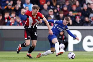 Cole Palmer and Nathan Collins battle for the ball during last seasons clash between Brentford and Chelsea