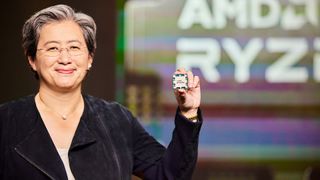 AMD&#039;s Dr Lisa Su holding a Zen 4 processor