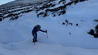 hiking in snow with poles