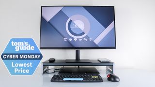 The Anker 675 USB-C Docking Station with a monitor on top, a laptop underneath and a Tom&#039;s Guide Cyber Monday deals badge