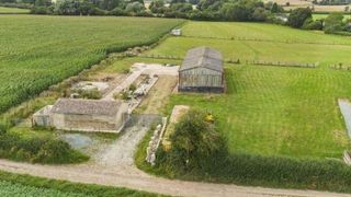 A steel barn on a large plot