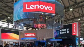 People gather at a Lenovo stand during the Consumer Electronics Show (CES) Asia in Shanghai on June 13, 2018