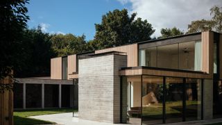 A passivhaus with wooden cladding and large glass windows