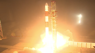 An Indian Space Research Organisation PSLV rocket launches at night