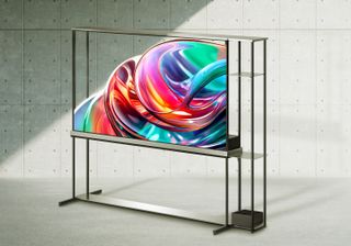 A transparent TV. It is on a white background. On the screen is an abstract colourful pattern.