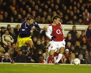 LONDON - JANUARY 4: David Bentley of Arsenal skips past Bobby Ford of Oxford United during the FA Cup Third Round match between Arsenal and Oxford United held on January 4, 2003 at Highbury in London, England. Arsenal won the match 2-0. (Photo By Shaun Botterill/Getty Images)