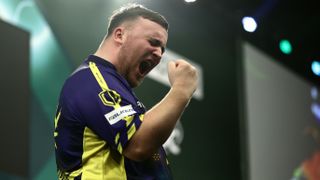 Luke Littler punches the air as he celebrates making the final of the PDC Darts World Championships