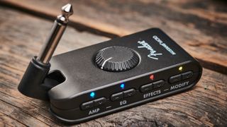 Fender Mustang Micro practice amp on a wooden floor