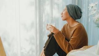 Woman drinking a hot drink