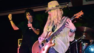 Alice Cooper (left) and Orianthi perform onstage at Webster Hall in New York City on July 17, 2013