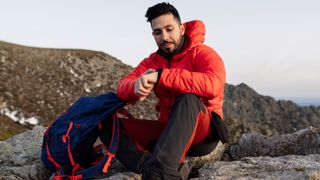 Man checking GPS watch during hike