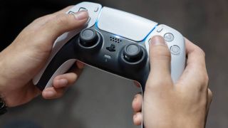 Someone holding a PS5 DualSense Controller