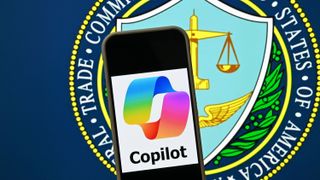 Microsoft&#039;s Copilot logo on a phone displayed in front of the logo of the FTC.