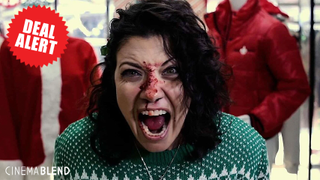 Girl wearing a Christmas jumper and screaming with blood splatters on her face in Deathcember