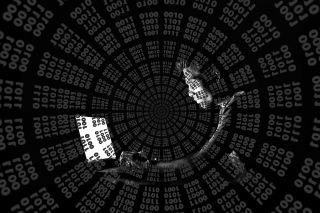 A menacing image of swirling computer code with the outline of a person in the background. 