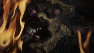 The Necronomicon burning in a fireplace in The Evil Dead