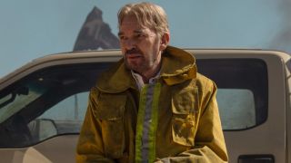 Billy Bob Thornton as Tommy Norris in a big yellow coat. 